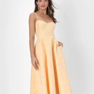 Meet for Tea Yellow Jacquard Bustier Midi Dress With Pockets
Elegant Yellow